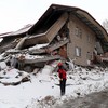 A rescuer works outside a destroyed building in quake-hit Elbistan district of Kahramanmaras, Türkiye, on Feb. 7, 2023. (Photo: Xinhua)