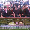 Prime Minister Pham Minh Chinh (front, fourth from right) and officials view a model of the Gia Binh Airport project (Photo: VNA)