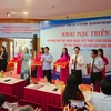 Delegates cut the ribbon to officially open the exhibition. (Photo: NDO)
