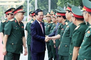 President Vo Van Thuong is welcomed by National Defence Academy staff (Photo: VNA)