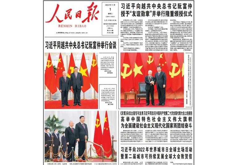 The People's Daily devoted more than half of its front page to solemnly publishing three photos between the two Party General Secretaries and the activities during the official visit. (Photo: HUU HUNG)