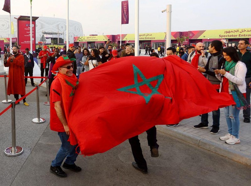 Morocco fans are pictured with the flag of Morocco outside the stadium before the quarter final match between Morocco and Portugal. (Photo: REUTERS)