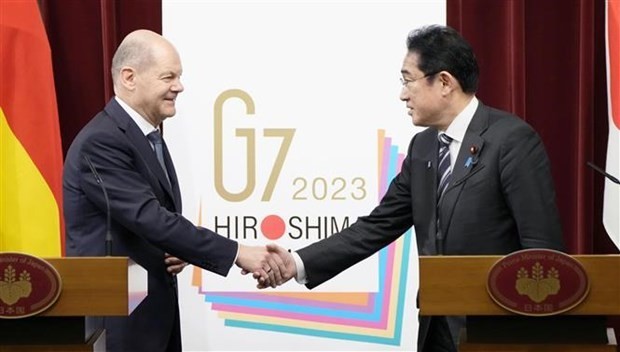German Chancellor Olaf Scholz and Japan's Prime Minister Fumio Kishida at a press conference in Tokyo, March 18, 2023. (Photo: Kyodo/VNA)