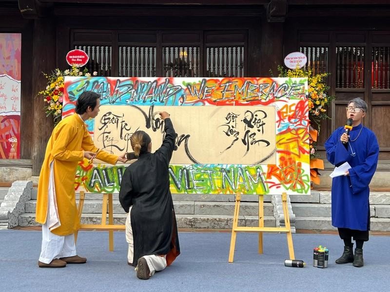 Graffiti artists and calligraphers perform a piece together at the opening ceremony. 