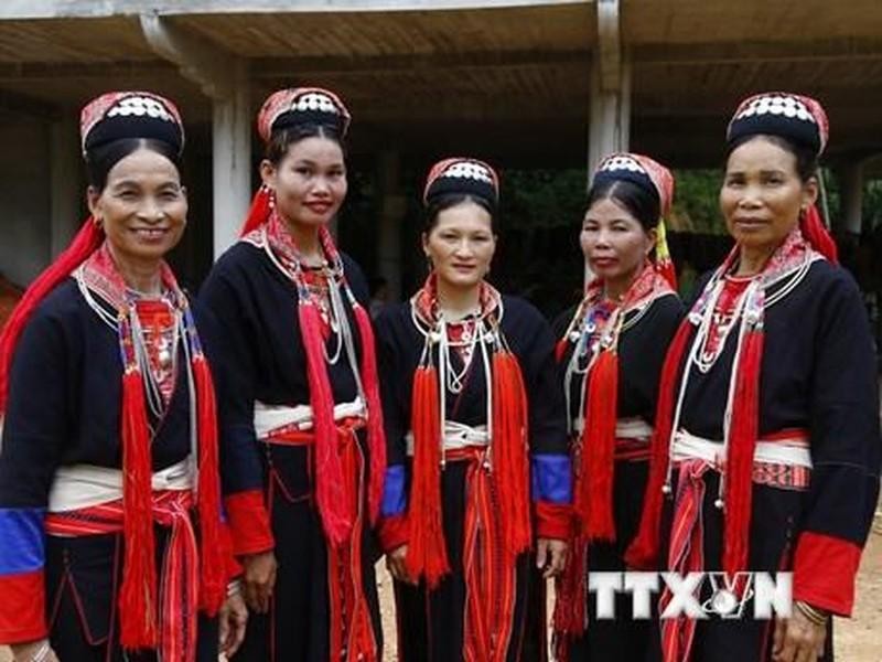 Characteristic red colour of Dao Thanh Y women's costumes.