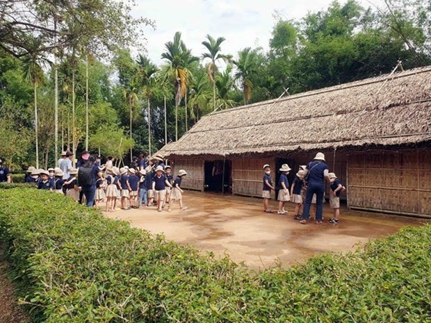 Tourists visit Hoang Tru, the home village of President Ho Chi Minh’s mother, where he was born. (Photo: VNA)