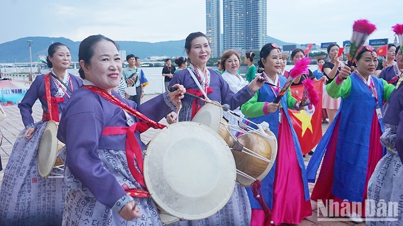 Artists perform along the Han River walking area.