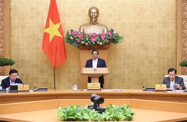 PM Pham Minh Chinh addresses the Government’s regular meeting for November in Hanoi on December 6. (Photo: VNA)