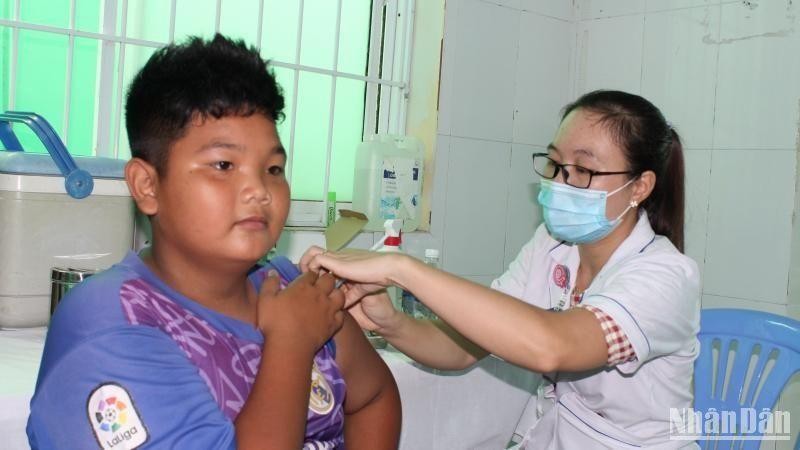A boy is vaccinated against COVID-19 in Ho Chi Minh City.