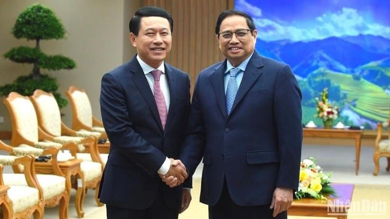 Prime Minister Pham Minh Chinh receives Lao Deputy PM and Minister of Foreign Affairs Saleumxay Kommasith in Hanoi on December 7. (Photo: Tran Hai)