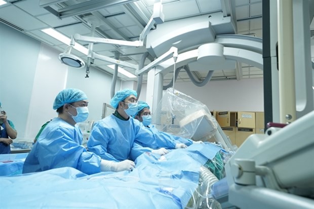 Doctors at the University Medical Centre in HCM City perform transcatheter pulmonary valve replacement on a patient with repaired tetralogy of Fallot. (Photo courtesy of the hospital)