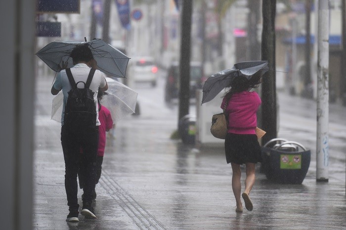 Parts of Japan were slammed by torrential rain on Friday as Tropical Storm Mawar neared.