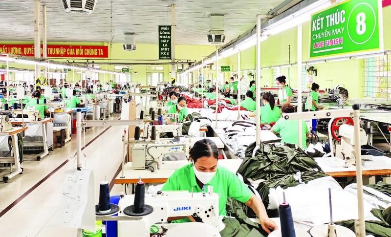 Producing garments for export at Nam Dinh Textile and Garment Corporation.