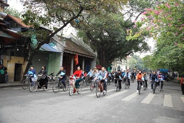 Participants cycle on a street around Hoan Kiem Lake on December 11. (Photo: VNA)
