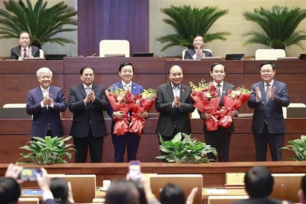 Tran Hong Ha (3rd, L) and Tran Luu Quang (2nd, R) officially become new Deputy Prime Ministers for the 2021-2026 tenure after the resolution receives “yes” votes from all of the 481 participating legislators. (Photo: VNA) 