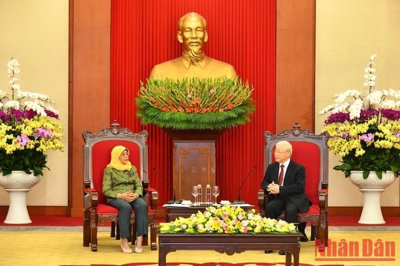 General Secretary of the Communist Party of Vietnam Nguyen Phu Trong (right) receives 