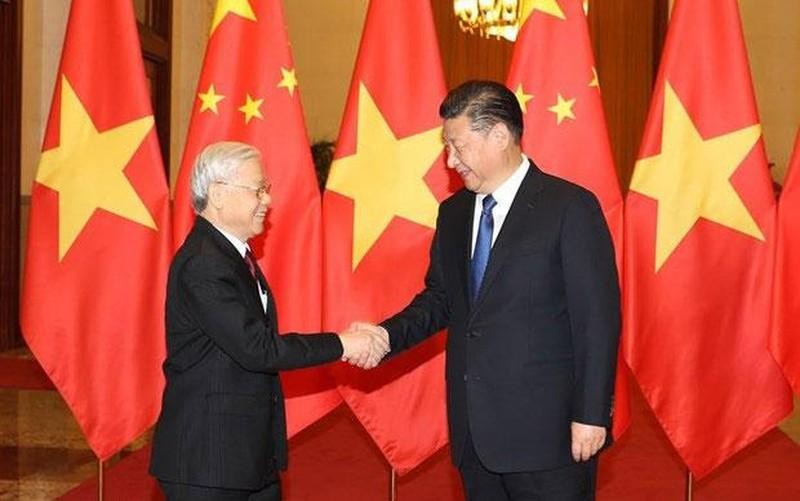 General Secretary of the Communist Party of China (CPC) Central Committee and President of China Xi Jinping receives General Secretary of the Communist Party of Vietnam (CPV) Central Committee Nguyen Phu Trong during the Vietnamese leader's visit to China in January 2017. (Photo: VNA)