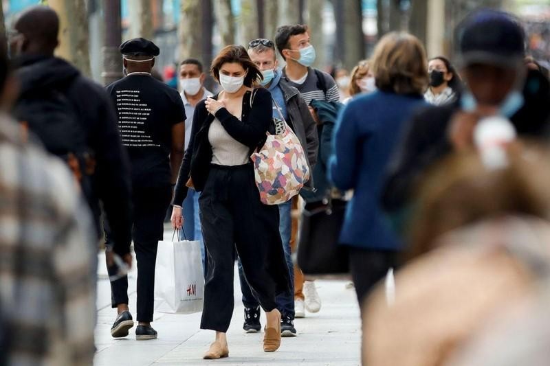 People walking on the Champs Elysees Avenue, in France, May 27, 2021. (Photo: Reuters)