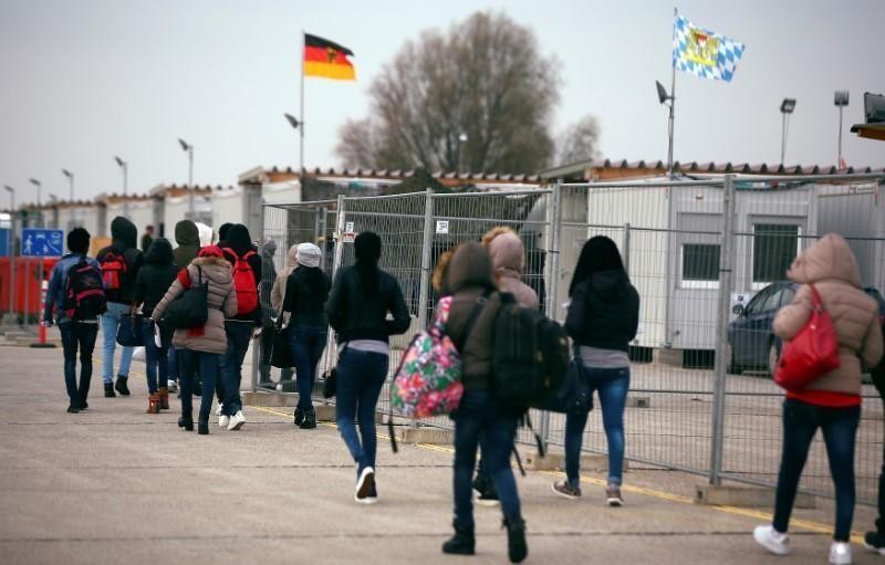 Eritrean migrants walk after arriving by plane from Italy at the first registration camp in Erding near Munich, Germany, November 15, 2016. (Photo: REUTERS)