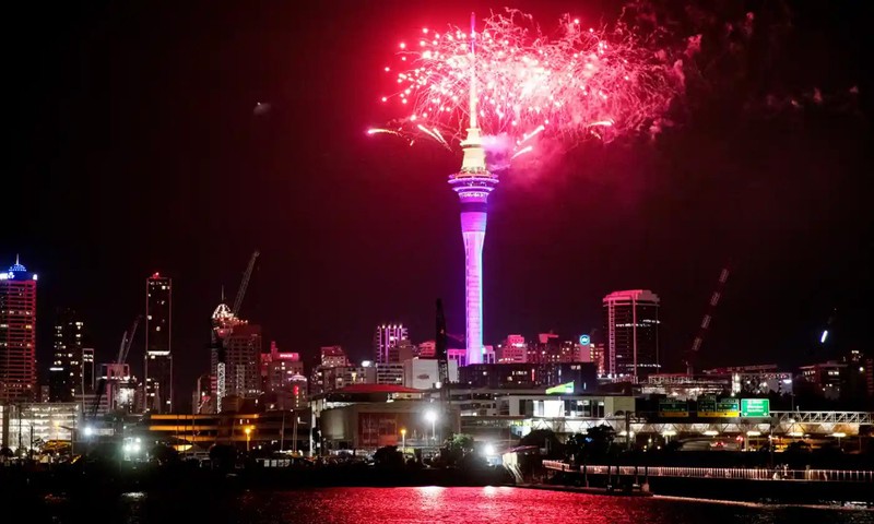 Large crowds flock to the Sky Tower in the centre of Auckland City, New Zealand, to immerse themselves in light and music. (Photo: AP)