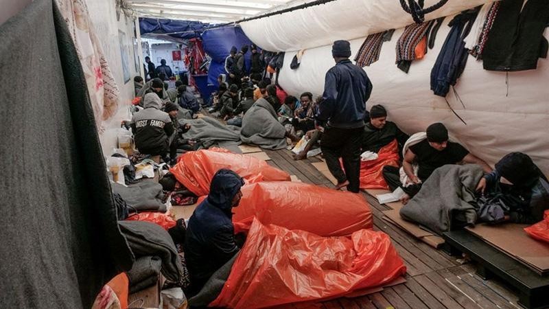 Migrants sleep on deck of NGO rescue ship 'Ocean Viking', in the Mediterranean Sea, November 6, 2022. (Camille Martin Juan/Sos Mediterranee/Handout via REUTERS)