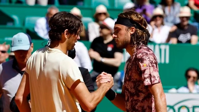 Taylor Fritz of the US and Greece’s Stefanos Tsitsipas shake hands after their quarterfinal match on April 14. (Photo: Reuters)