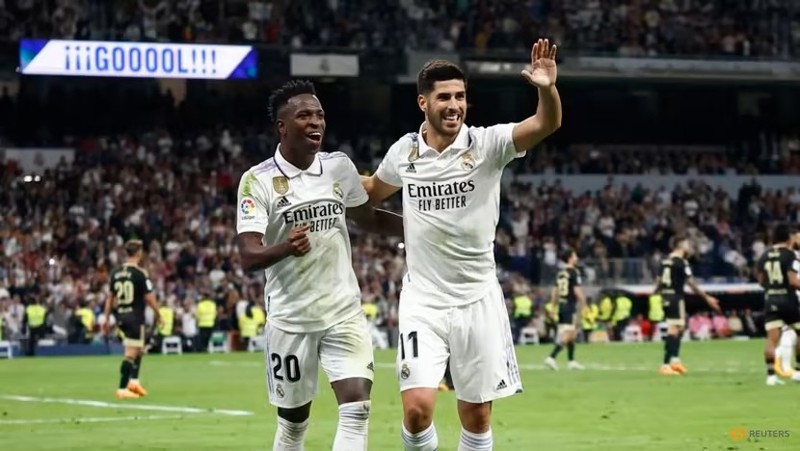 Real Madrid’s Marco Asensio celebrates scoring their first goal with Vinicius Junior. (Photo: Reuters)