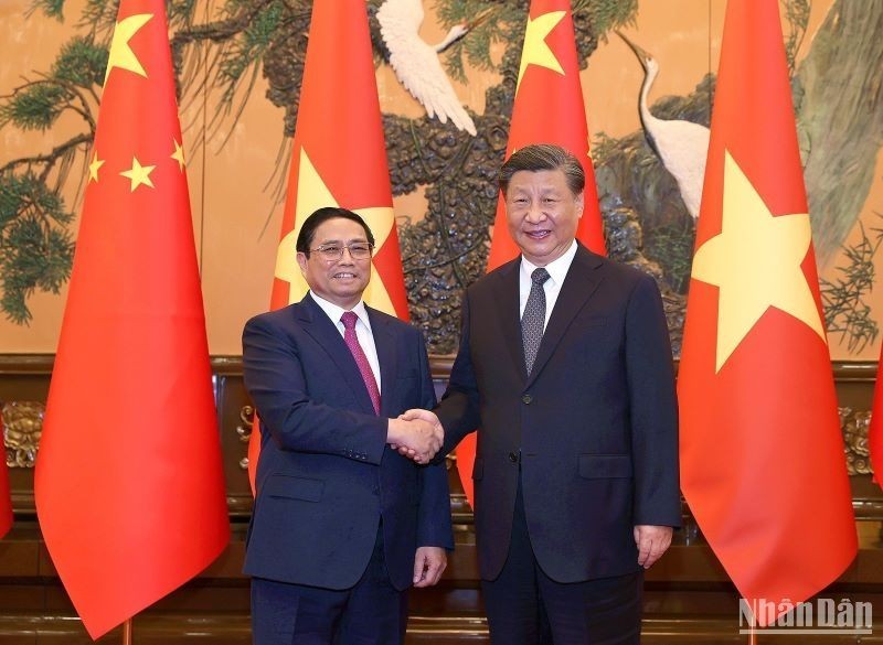 Prime Minister Pham Minh Chinh (L) and Party General Secretary and President of China Xi Jinping. (Photo: NDO)
