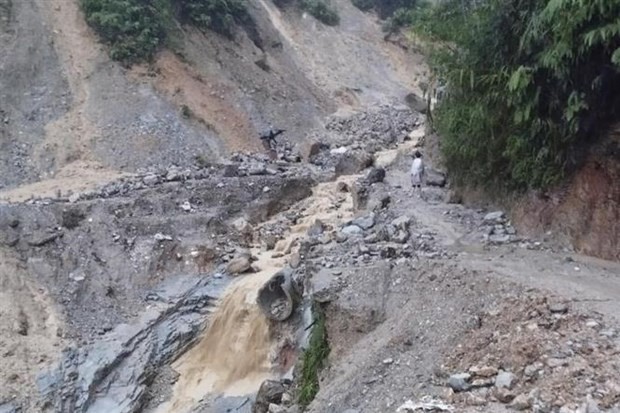 A concrete road in Chau Hoi commune, Quy Chau district of Nghe An province has been destroyed by flash floods.(Photo: VNA) 