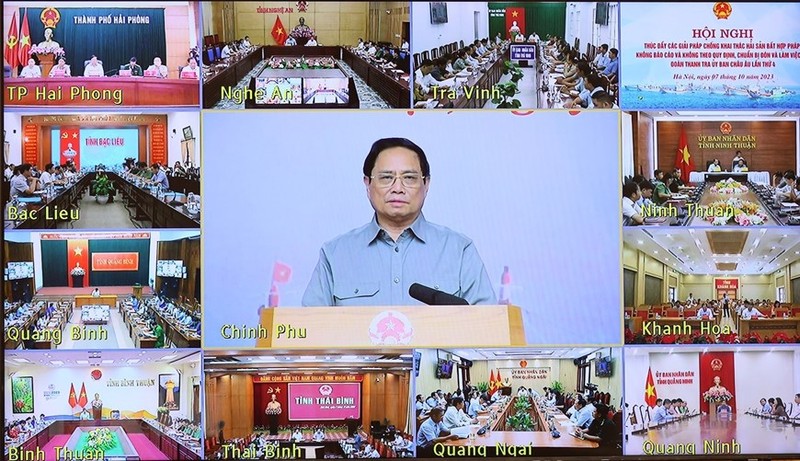 Prime Minister Pham Minh Chinh (centre) chairs the anti-IUU teleconference from Hanoi on October 7. (Photo: VNA)