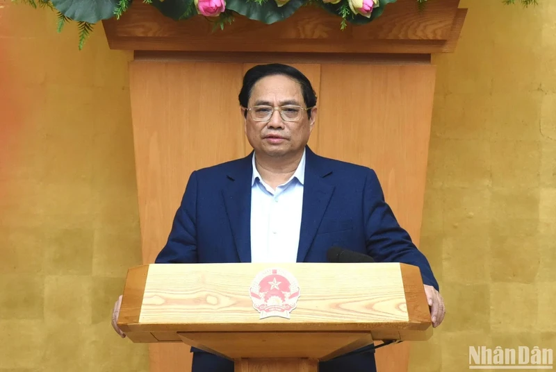 PM Pham Minh Chinh delivers an opening speech at the meeting, noting that the important immediate task is to organise a warm, joyful, meaningful, healthy, safe and economical Tet (Lunar New Year) Festival for people.