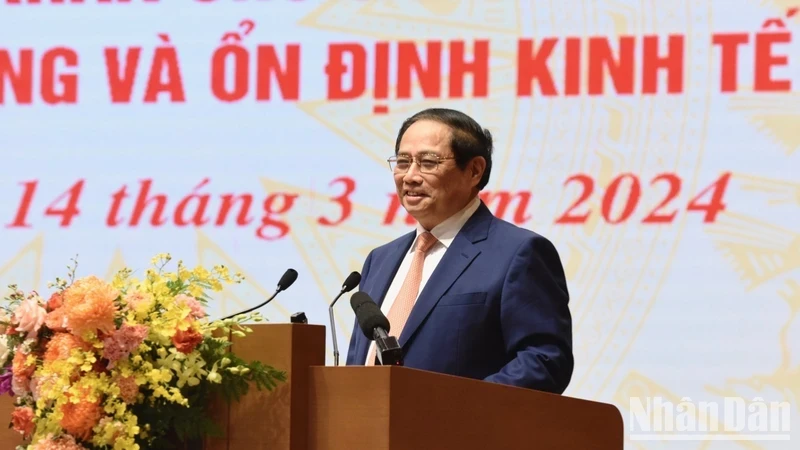 PM Pham Minh Chinh speaks at the conference held on March 14 to launch monetary policy-related tasks for this year. (Photo: NDO)