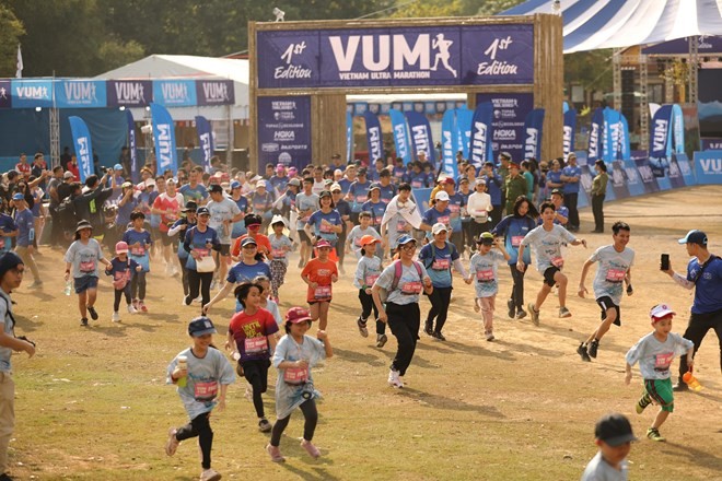 Runners take part in the 5km event (Photo: VNA)