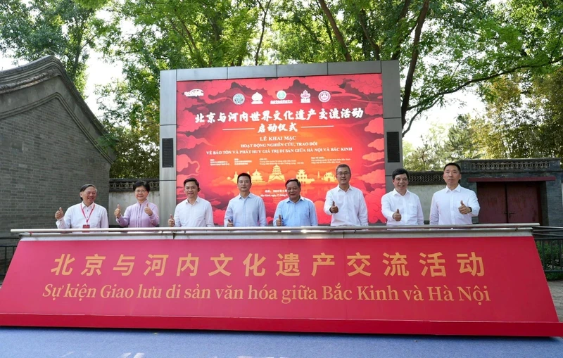 Delegates attend the ceremony to open study and exchange activities on preservation and promotion of heritage values between Hanoi and Beijing.