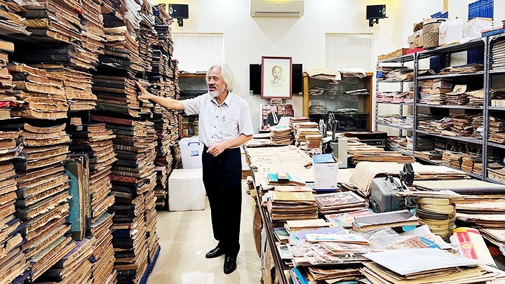 Nguyen Phi Dung in his vast archive.