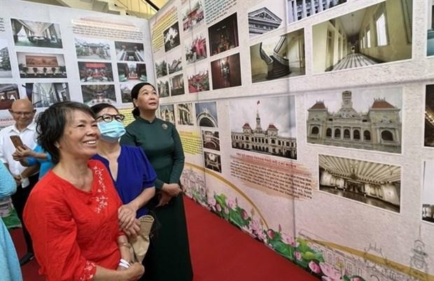 HCM City’s residents view photos of the city and District 1’s history and cultural heritage sites, which are on display at an exhibition at District 1’s Cultural Centre. (Photo: VNA)