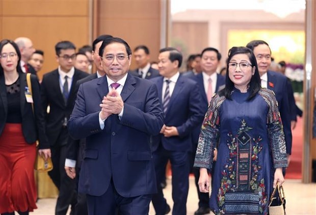 PM Pham Minh Chinh and his wife arrive at the banquet in Hanoi on January 9. (Photo: VNA)
