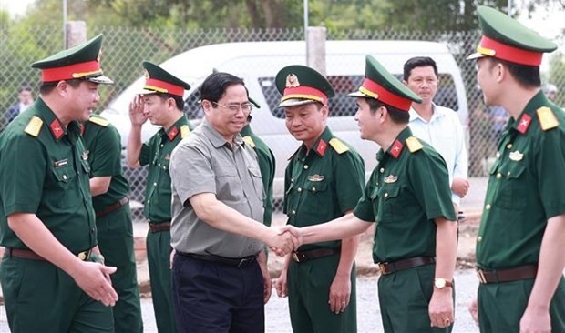 PM Pham Minh Chinh visits Army Corps 12 under Truong Son Construction Corporation that is constructing a section of the eastern North-South Expressway that runs through Can Tho and Hau Giang. (Photo: VNA)