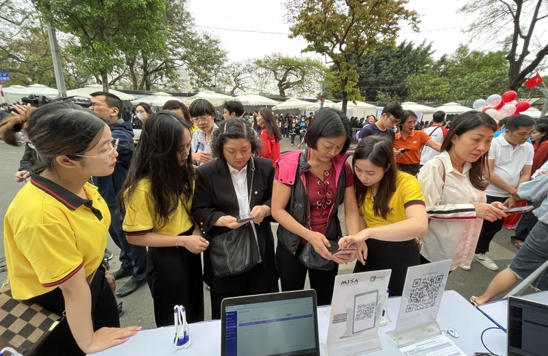 Digital signatures issued for free at Hanoi pedestrian street.