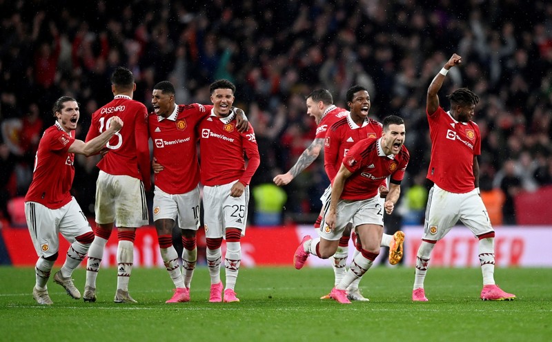 Manchester United players celebrate after winning the penalty shootout - FA Cup - Semi Final - Brighton & Hove Albion v Manchester United - Wembley Stadium, London, the UK - April 23, 2023. (Photo: Reuters)