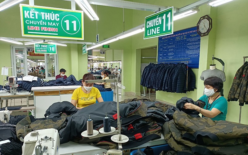 Producing textiles for export at Nam Dinh Textile and Garment Joint Stock Corporation.