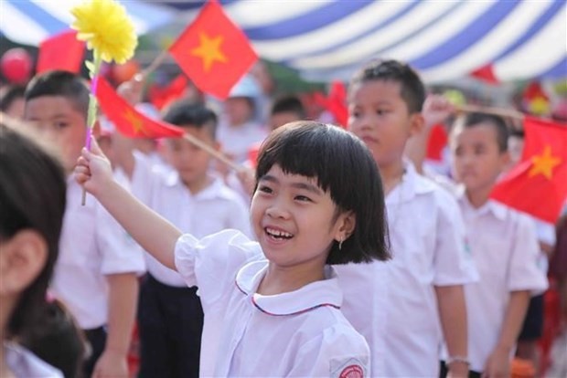 A little Vietnamese girl's cheerful face on the first day of a new school year. (Photo: VNA)