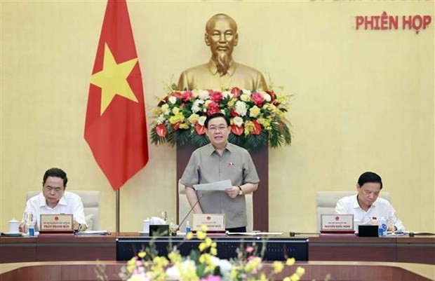 NA Chairman Vuong Dinh Hue (centre) delivers the opening remarks at the 24th session of the NA Standing Committee on July 12. (Photo: VNA)