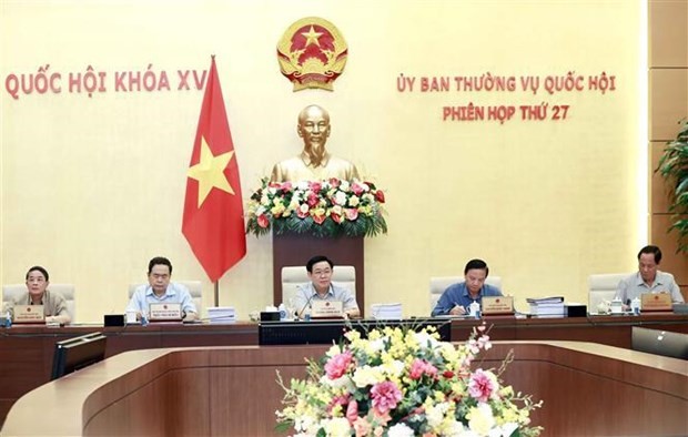 NA Chairman Vuong Dinh Hue (middle) addresses the event (Photo: VNA)