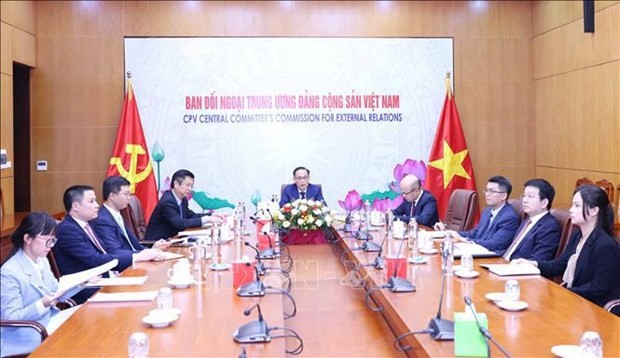 At the online talks between Le Hoai Trung, Secretary of the Communist Party of Vietnam (CPV) Central Committee and Chairman of the CPV Central Committee’s Commission for External Relations, and Mourad Lamoudi, who is in charge of external relations at the National Liberation Front (FLN) Party Central Committee of Algeria. (Photo: VNA)