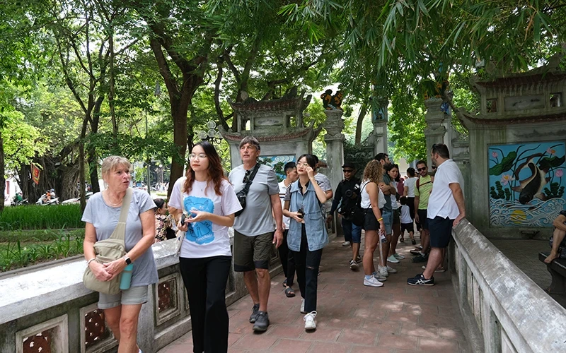 Foreign tourists visit Ngoc Son Temple, Hanoi. (Photo by HO HA)