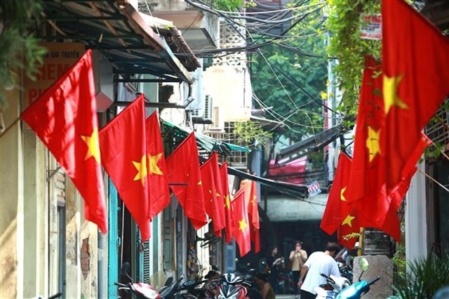 Every year, many streets in Hanoi are decorated with national flags to celebrate the National Day holiday. (Photo: VNA)