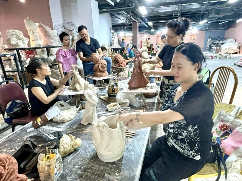 Making artistic pottery in Bat Trang Pottery Village. 