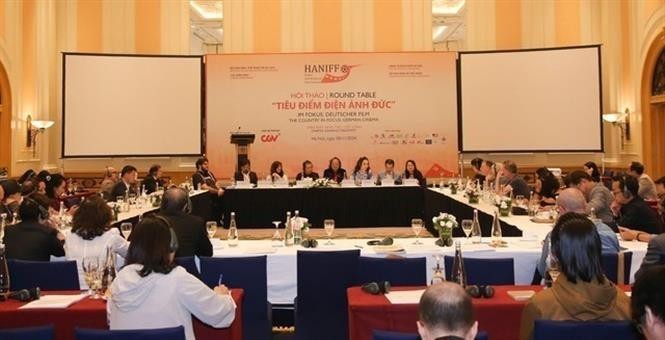 Filmmakers, experts, actors and actresses from Vietnam and Germany at the workshop to share experience in developing the cinema industry. (Photo: VNA)