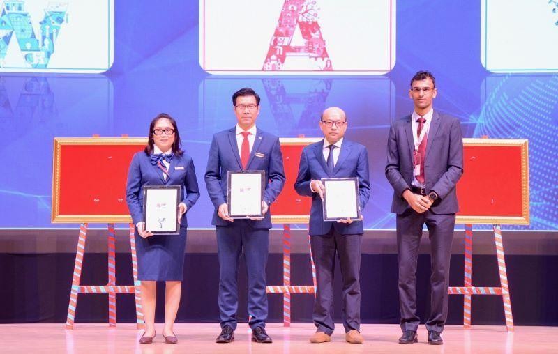 Representatives of Ton Duc Thang University receive certificates from the Times Higher Education.